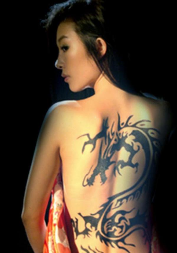Black Tribal Dragon Tattoo On Girl Full Back