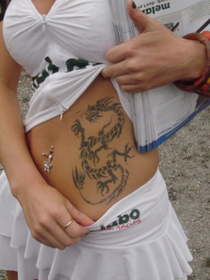 Black Tribal Dragon Tattoo On Girl Left Side Rib