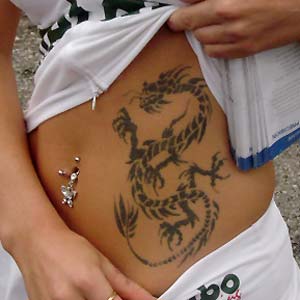 Black Tribal Dragon Tattoo On Girl Stomach