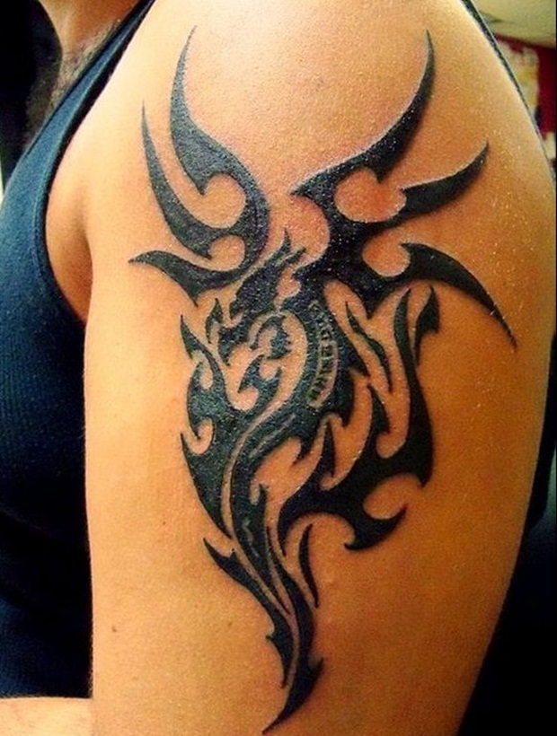 Black Tribal Dragon Tattoo On Man Left Half Sleeve