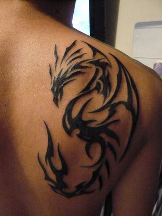 Black Tribal Dragon Tattoo On Man Right Back Shoulder