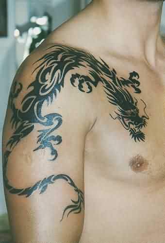 Black Tribal Dragon Tattoo On Man Right Shoulder