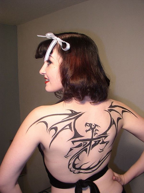 Black Tribal Dragon With Cross Tattoo On Women Upper Back