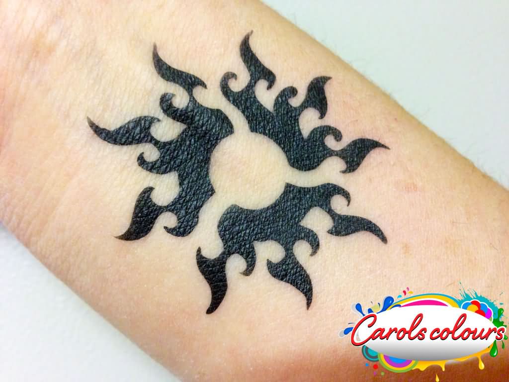 Black Tribal Sun Tattoo On Wrist