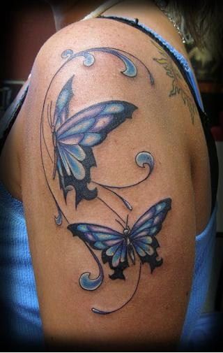 Blue And Black Ink Butterfly Tattoo On Left Shoulder