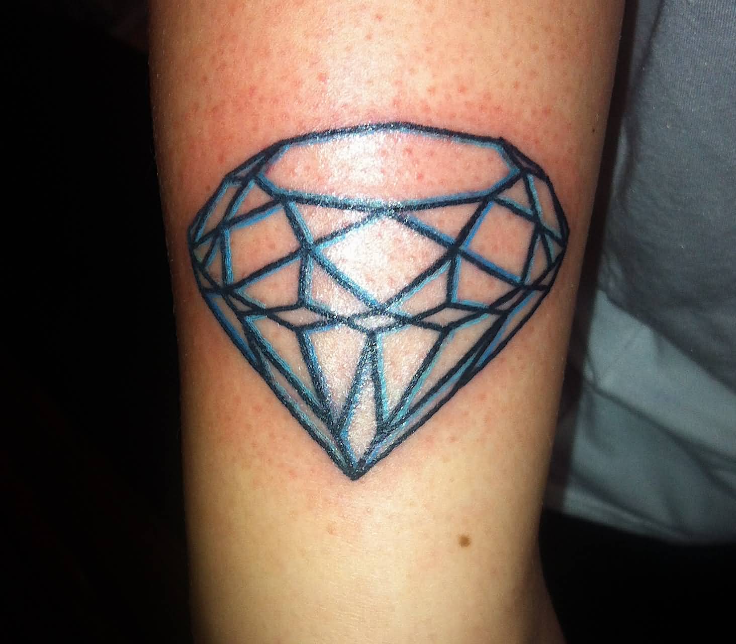 Blue And Black Lines Diamond Tattoo On Bicep