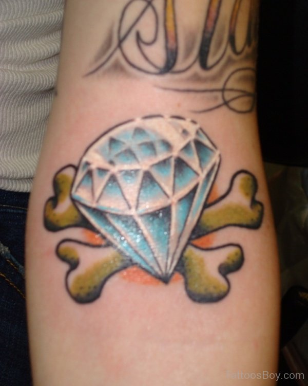Blue Diamond With Bones Tattoo On Left Forearm