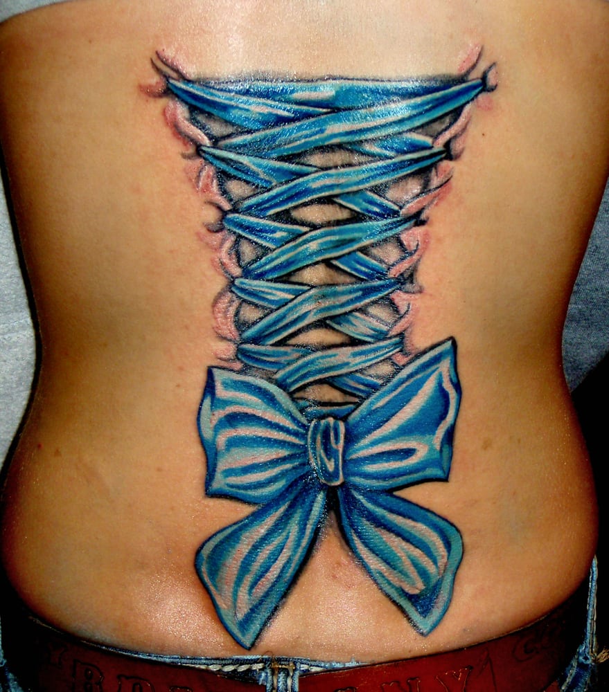 Blue Ink Corset With Bow Tattoo On Full Back By Martin