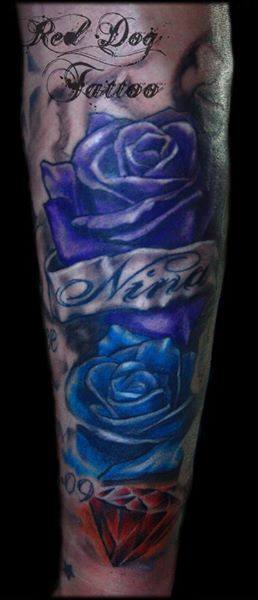 Blue Ink Roses With Banner Tattoo On Arm