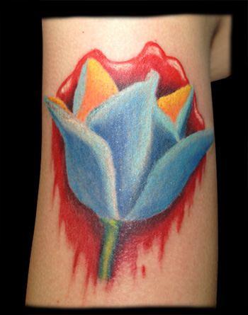 Blue Ink Tulip Tattoo On Bicep