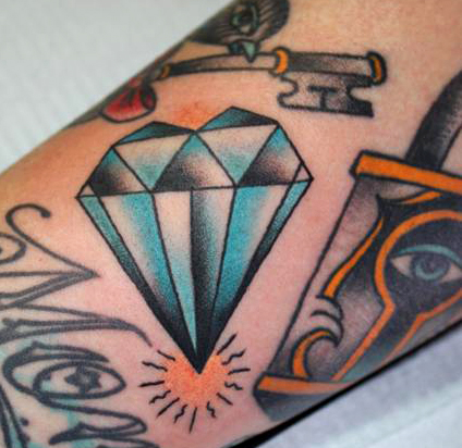 Blue and Black Diamond Tattoo On Arm