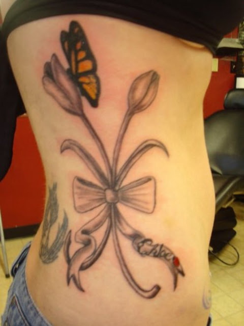 Butterfly Tulip Tattoo On Side Rib For Girls