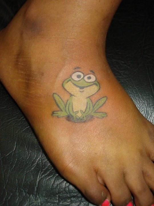 Cartoon Frog Tattoo On Girl Right Foot
