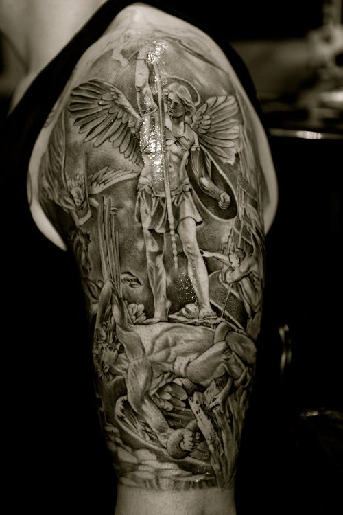 Classic Black And Grey Archangel Michael Tattoo On Man Left Half Sleeve