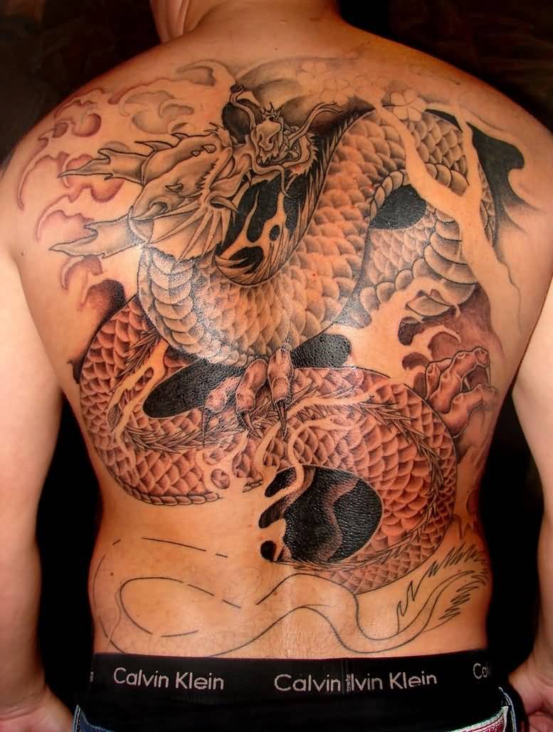 Classic Black And Grey Dragon Tattoo On Man Full Back