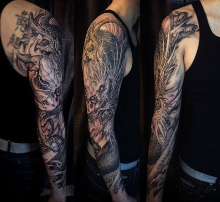 Classic Black And Grey Dragon Tattoo On Man Right Full Sleeve By Tony