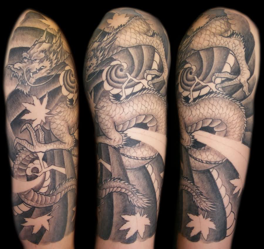 Classic Black And Grey Dragon Wrap Around Tattoo On Half Sleeve