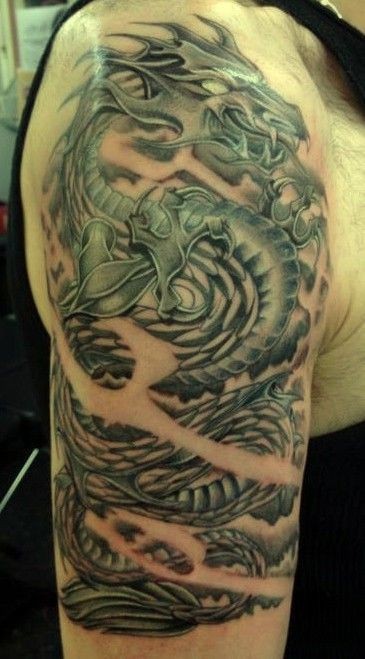 Classic Black Ink Dragon Tattoo On Man Right Half Sleeve