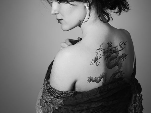 Classic Black Ink Dragon Tattoo On Women Upper Back