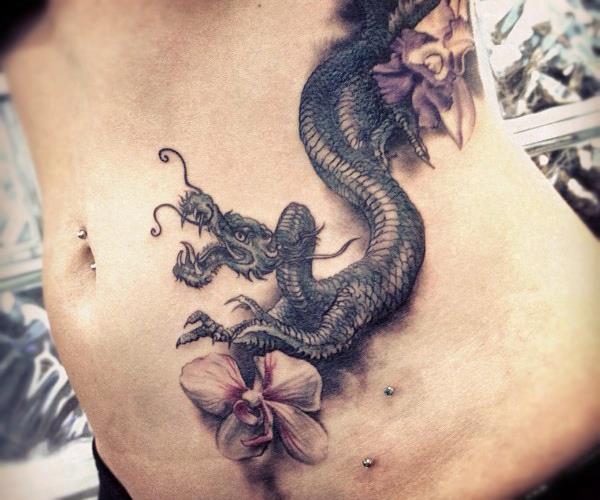 Classic Black Ink Dragon With Flowers Tattoo On Left Side Rib