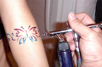 Colorful Airbrush Butterfly Tattoo On Arm