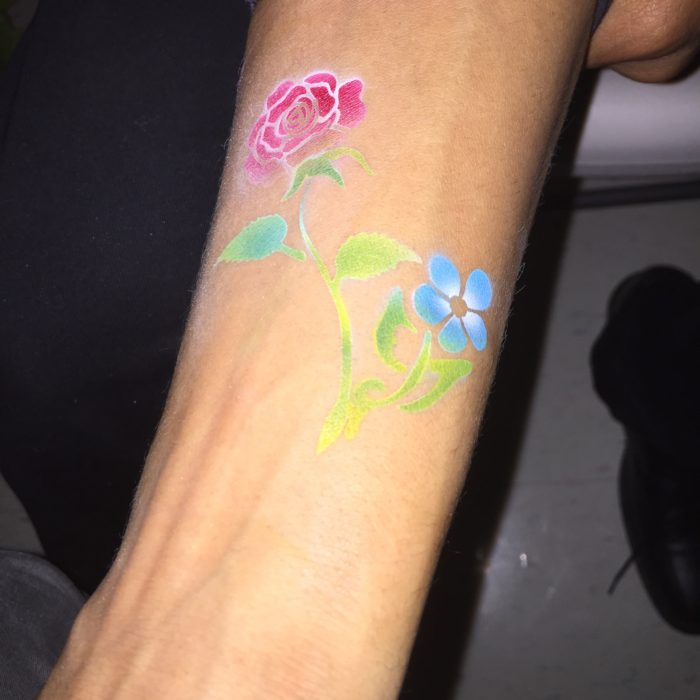 Colorful Airbrush Flowers Tattoo On Left Arm