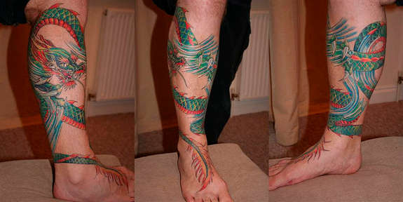 Colorful Dragon Tattoo On Right Leg Calf