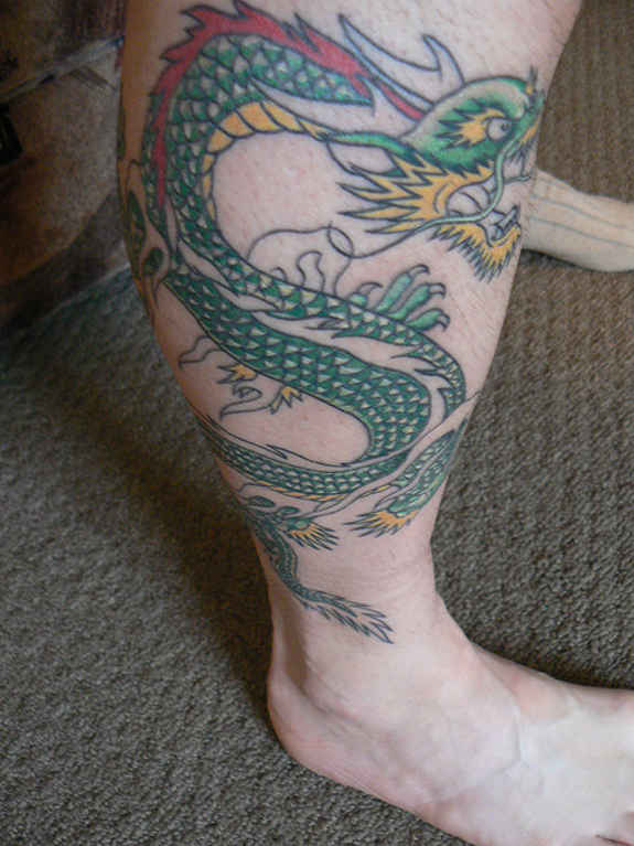 Colorful Dragon Tattoo On Right Leg