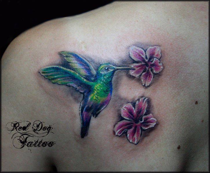 Colorful Flying Bird With Flowers Tattoo On Left Back Shoulder