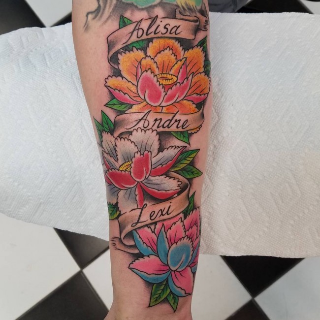 Colorful Japanese Peony Flowers With Banner Tattoo On Forearm