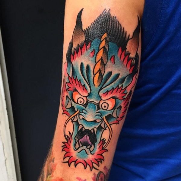 Colorful Traditional Dragon Head Tattoo On Left Half Sleeve