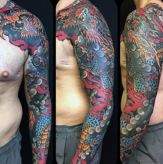 Colorful Traditional Dragon Tattoo On Man Left Full Sleeve