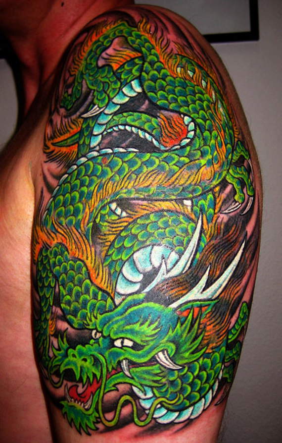 Colorful Traditional Dragon Tattoo On Man Left Half Sleeve