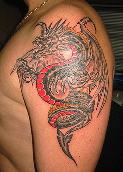 Colorful Traditional Dragon Tattoo On Man Left Shoulder