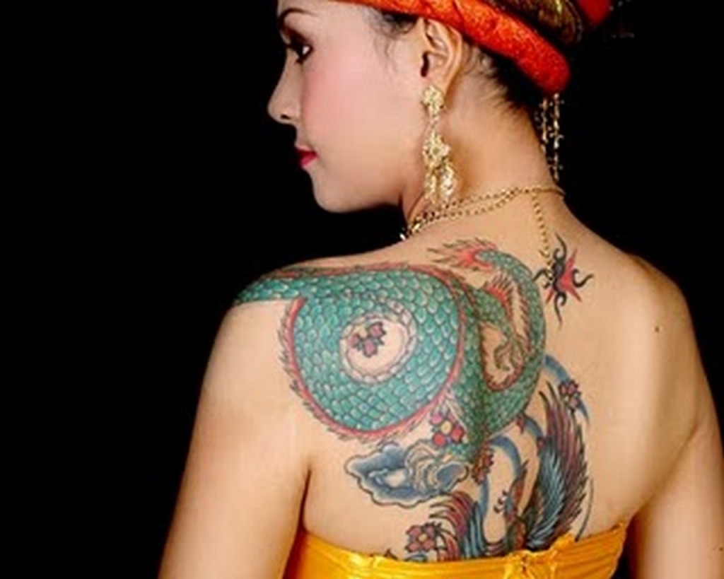 Colorful Traditional Dragon Tattoo On Women Left Back Shoulder