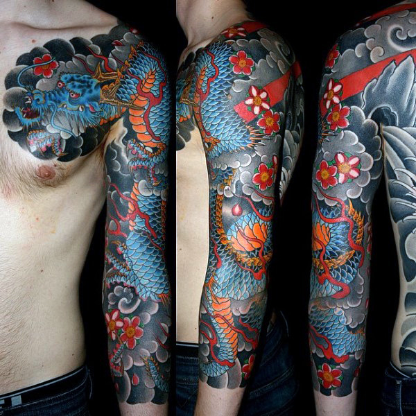 Colorful Traditional Dragon With Flowers Tattoo On Man Left Full Sleeve