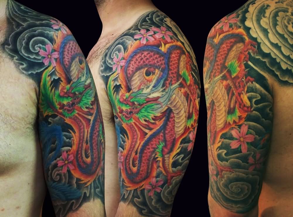 Colorful Traditional Dragon With Flowers Tattoo On Man Left Half Sleeve