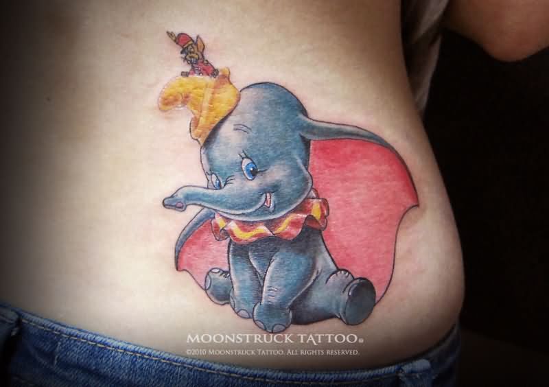 Colorful Traditional Dumbo Tattoo On Lower Back.
