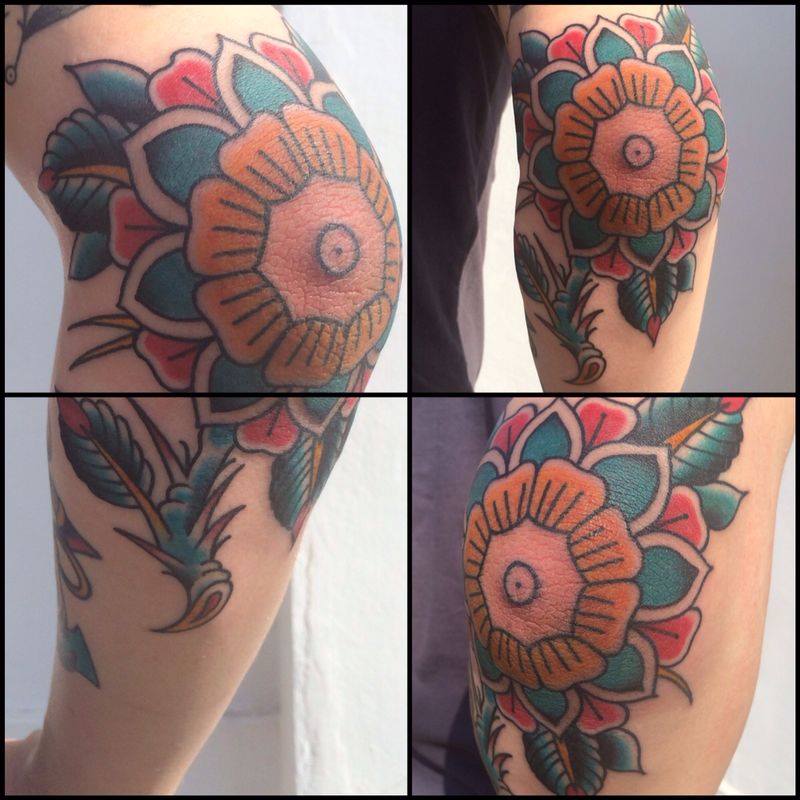 Colorful Traditional Flower Tattoo On Elbow By Chris Martin