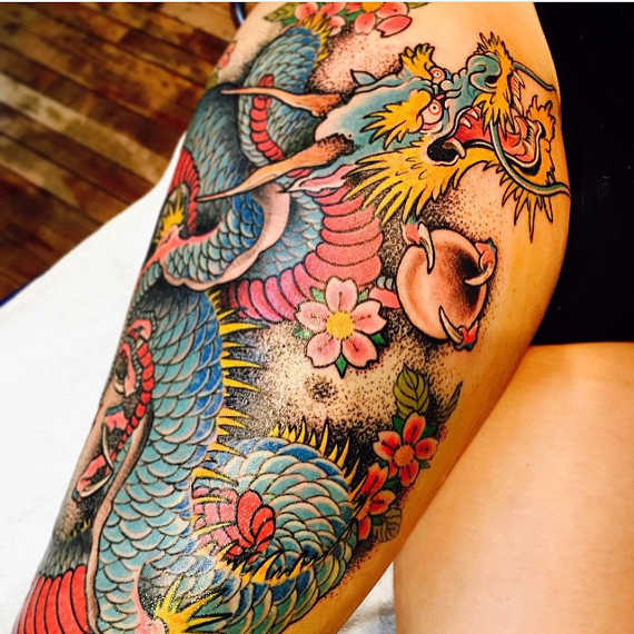 Colorful Traditional Japanese Dragon With Flowers Tattoo On Right Thigh