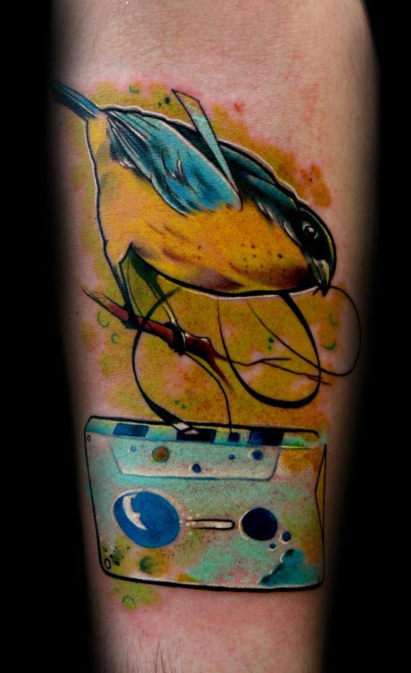 Cool Bird With Cassette Tattoo On Sleeve