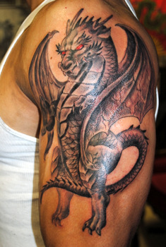 Cool Black Ink Dragon Tattoo On Left Half Sleeve