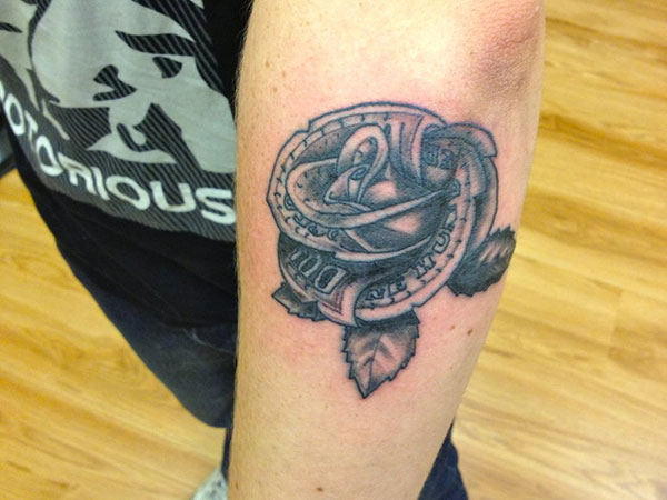 Cool Black Ink Money Rose Tattoo On Elbow