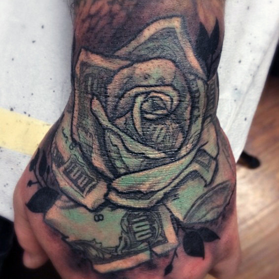 Cool Black Ink Money Rose Tattoo On Hand