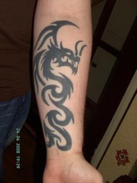 Cool Black Tribal Dragon Tattoo On Left Forearm