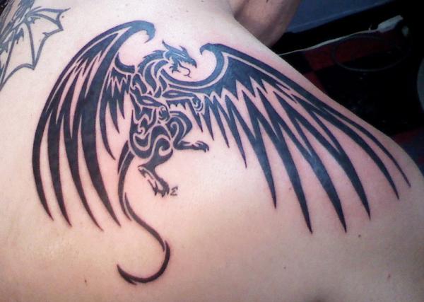 Cool Black Tribal Flying Dragon Tattoo On Man Right Back Shoulder