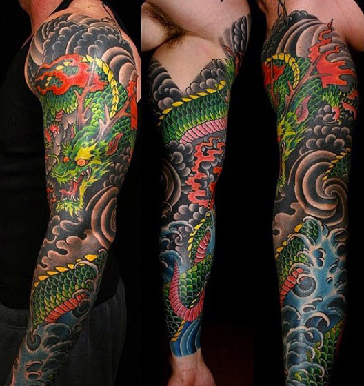 Cool Colorful Traditional Dragon Tattoo On Man Left Full Sleeve