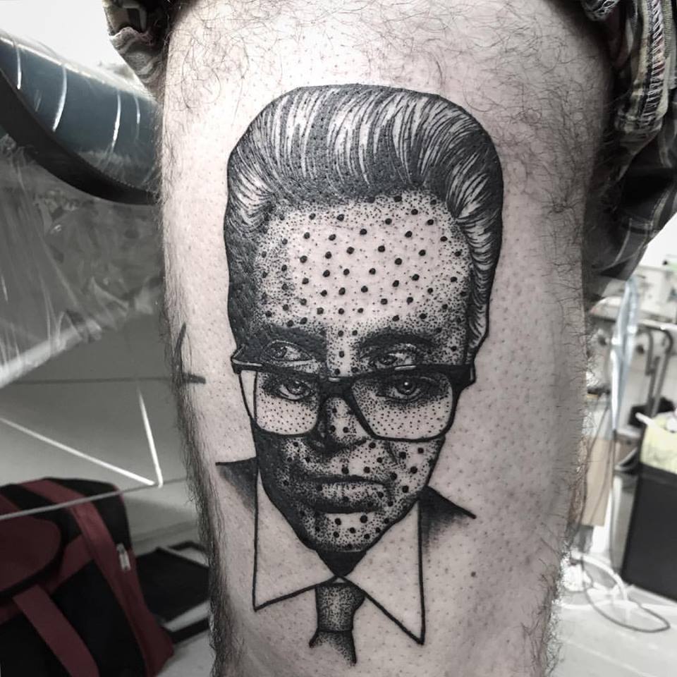 Cool Dotwork Man Face Tattoo On Thigh