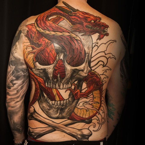 Cool Dragon In Skull Tattoo On Man Full Back