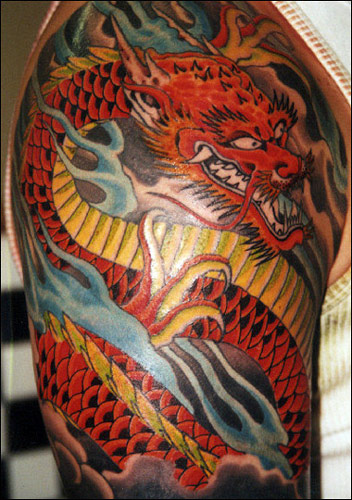 Cool Traditional Dragon Tattoo On Right Half Sleeve